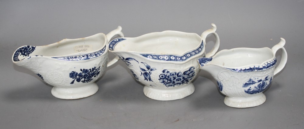 A Lowestoft blue and white sauceboat, c.1770 and two Worcester blue and white sauceboats, c.1758-65